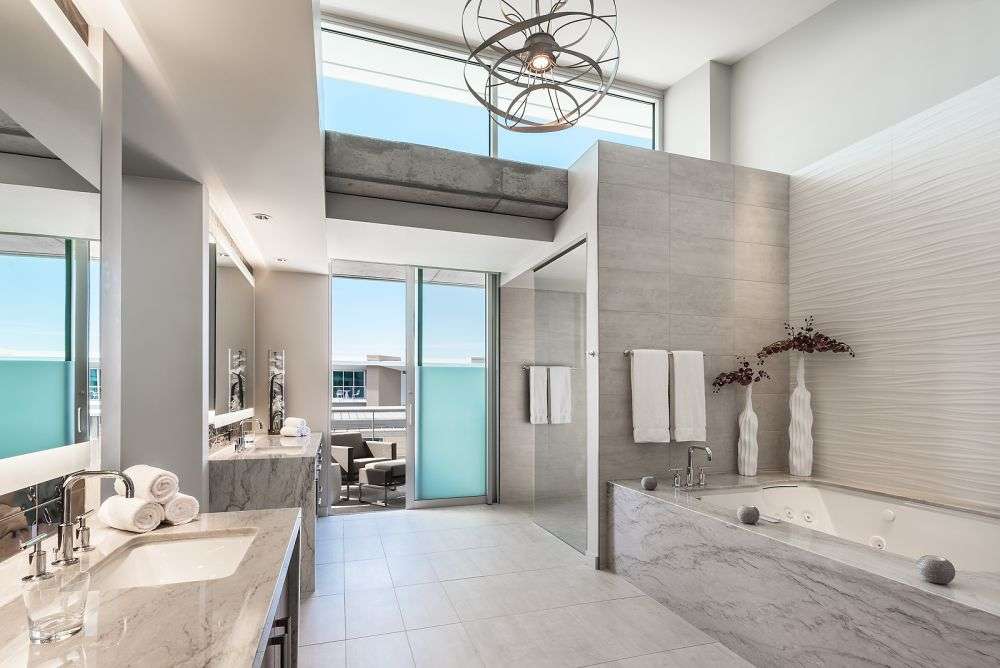 a large bathroom with a door that leads to the outside