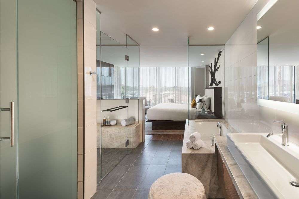 a bathroom connected to a bedroom