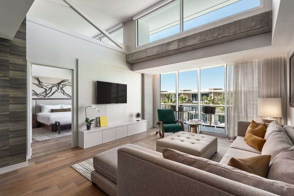 a room featuring couches and a tv