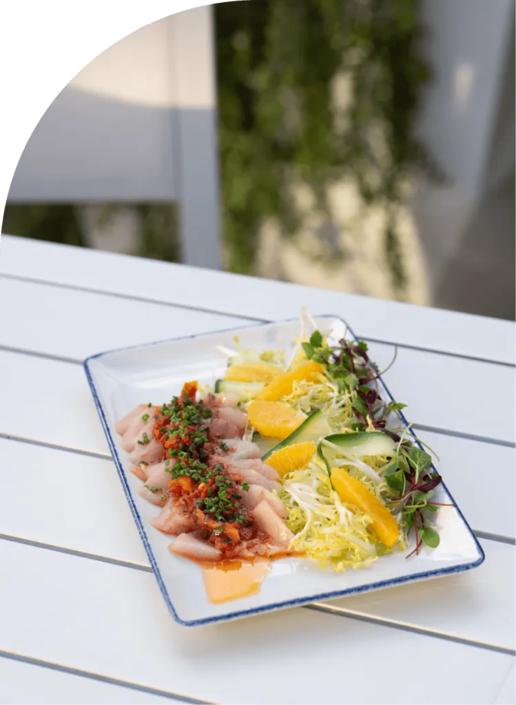 A white table featuring a delicious plate of food.