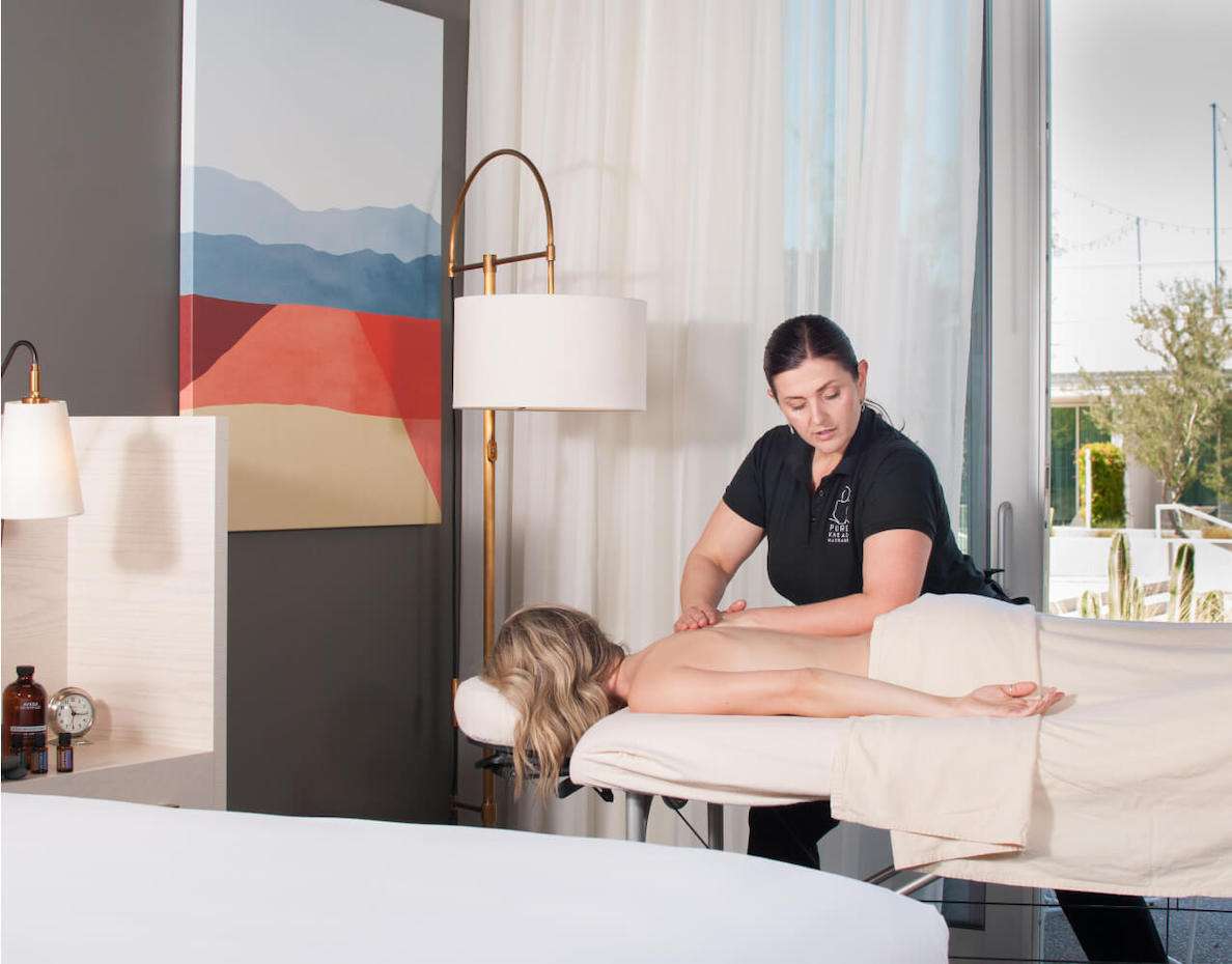 Woman lying down and getting a massage