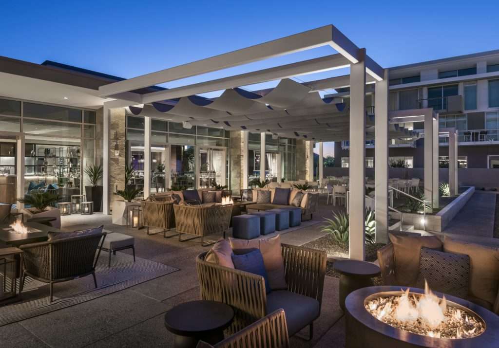 Hearth '61 patio at night with firepit on