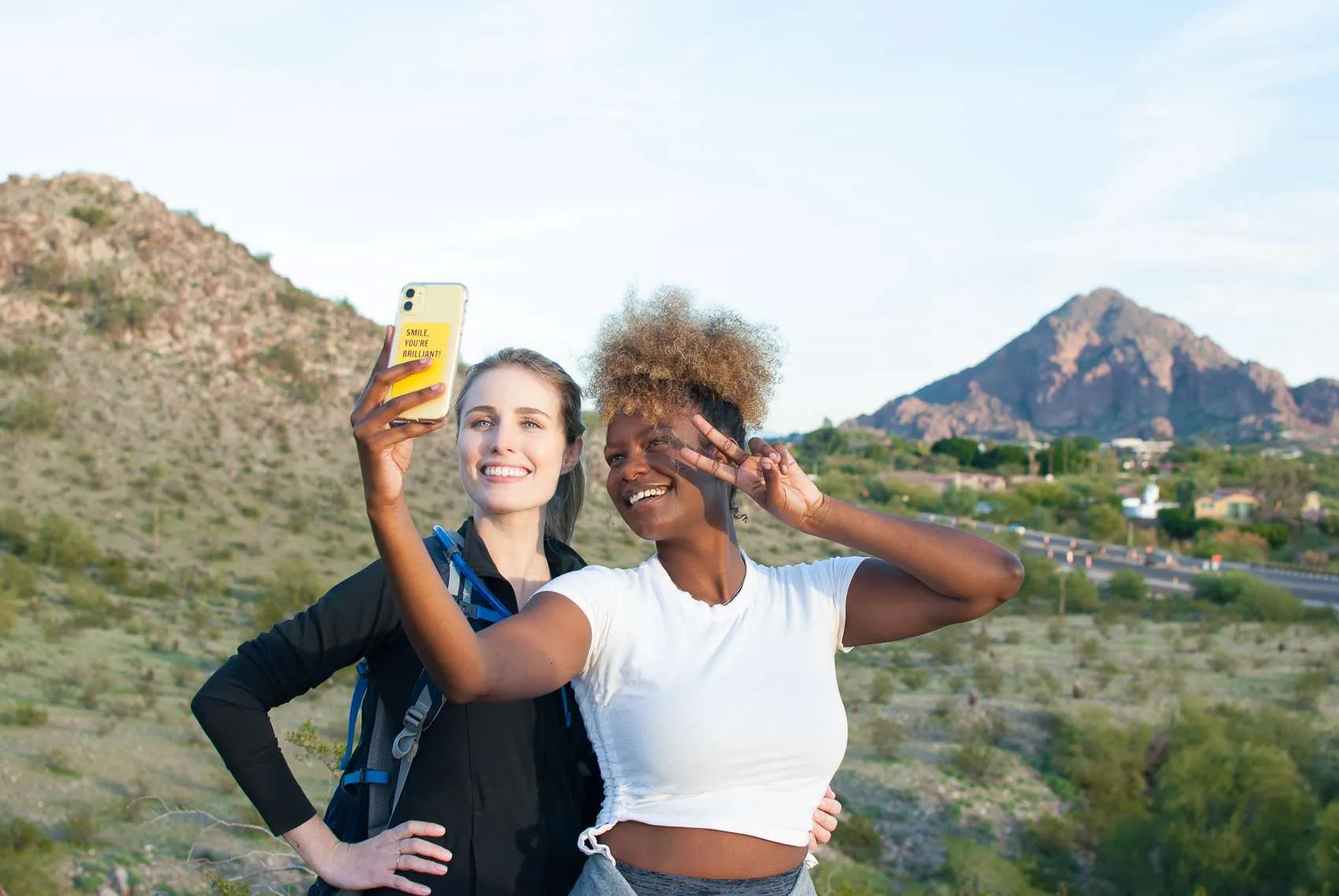 Two women hiking and taking a selfie